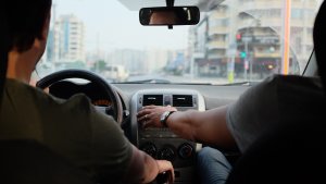 Three man in a car.