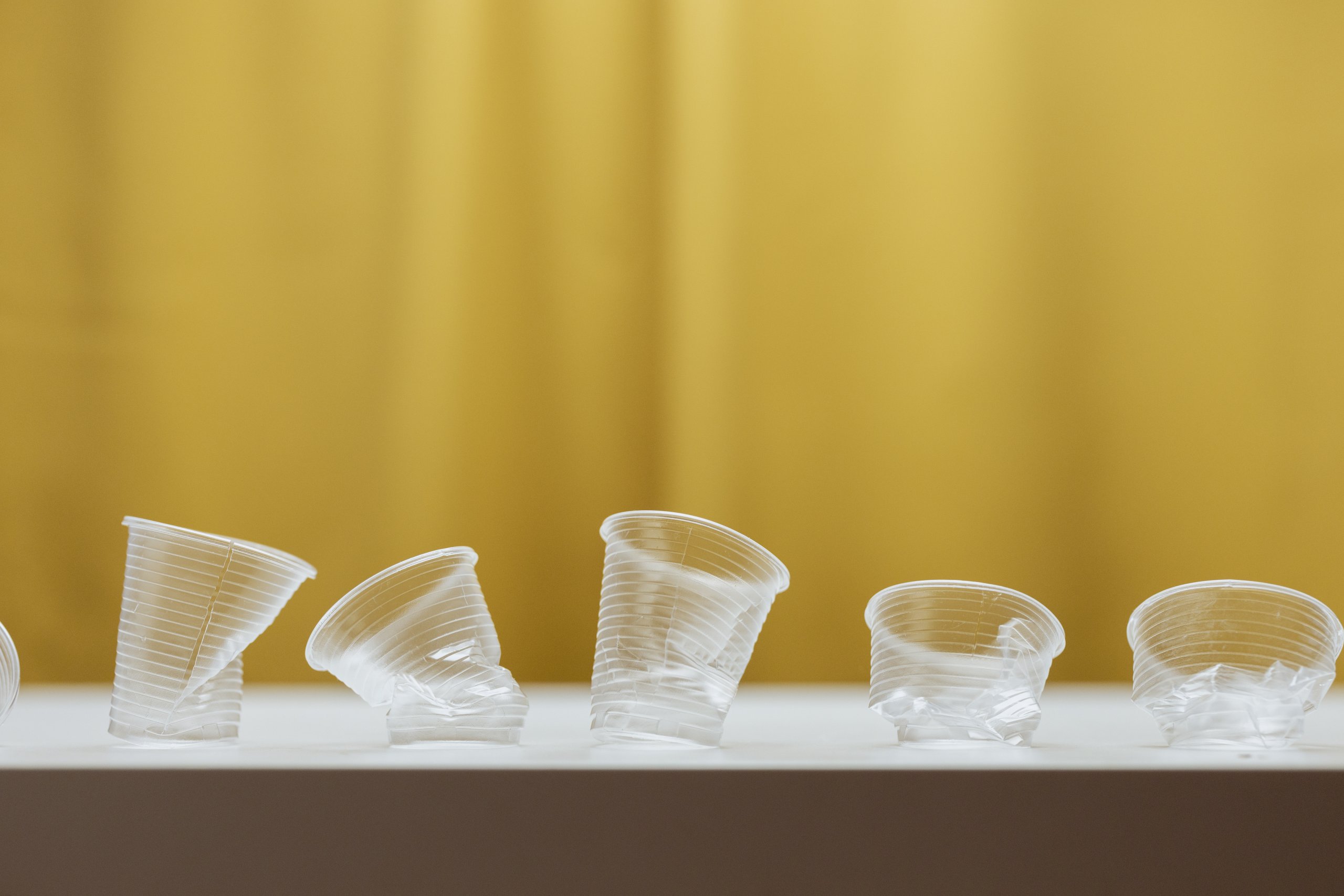 Clear plastic cups on white table